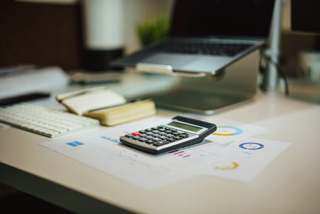 A calculator and tax forms.