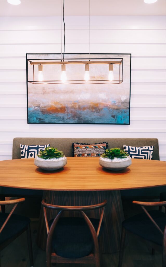 Dining table with white shiplap as an inexpensive backsplash ideas