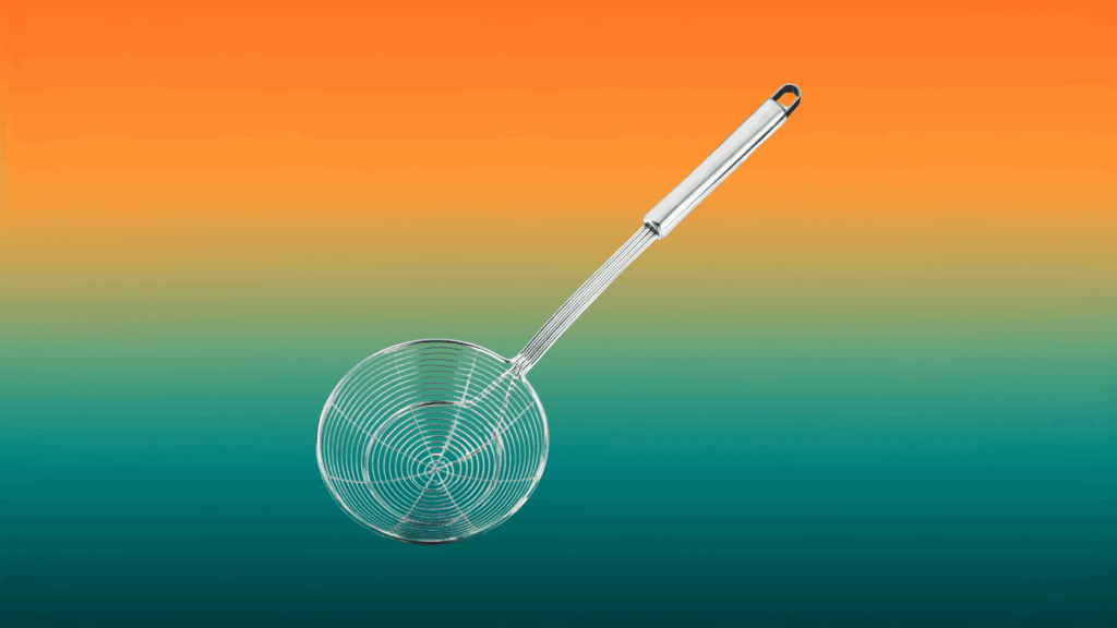 stainless steel spider strainer in front of an orange and teal background