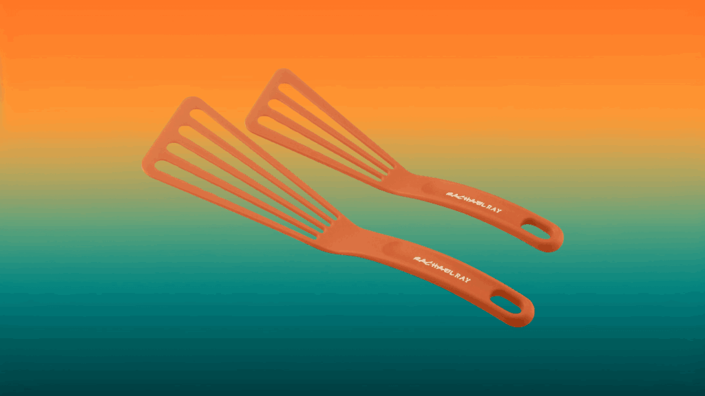 two orange fish spatulas in front of an orange and teal background