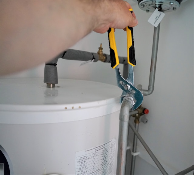 Entry construction jobs - a man fixing a pipe
