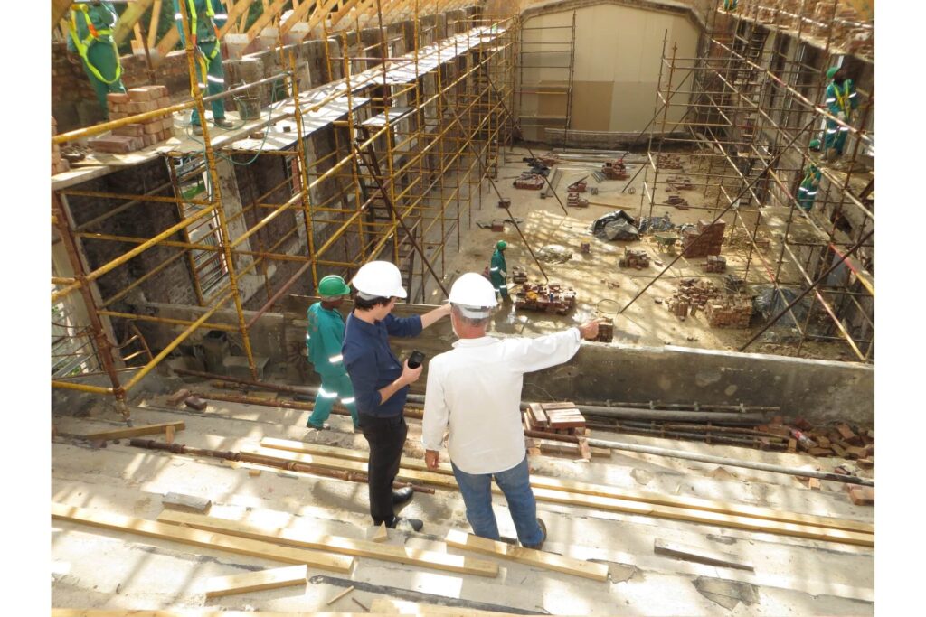 General contractor having a conversation with the project owner at the job site