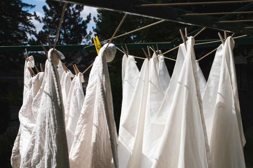 rugs hanging on a clothesline