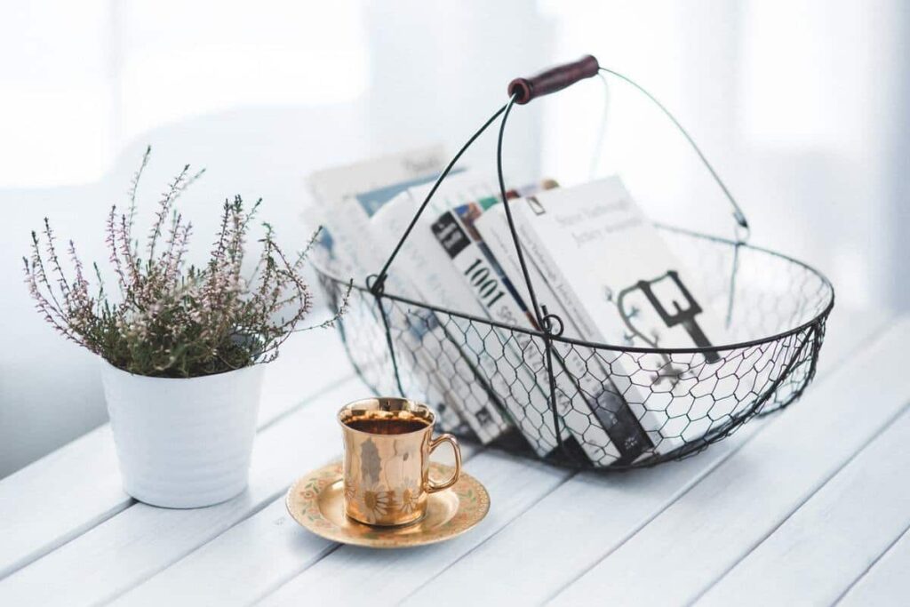 metal accent pieces, such as a black basket, teacup, and planter