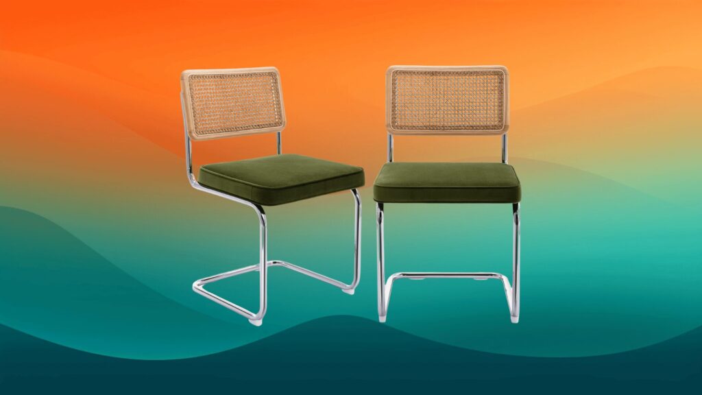 two velvet green dining chairs mid-century modern fur4niture in front of an orange and teal background