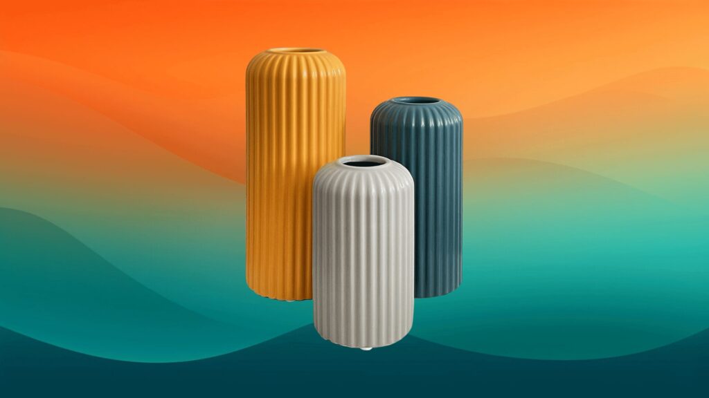 three yellow, gray, and teal vases in front of an orange and teal background
