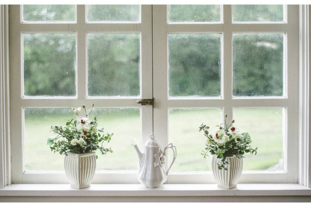 A pair of white casement windows