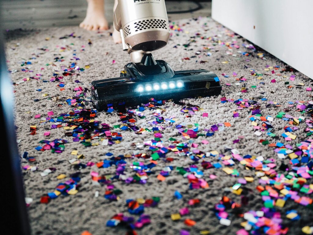 vacuuming a messy carpet