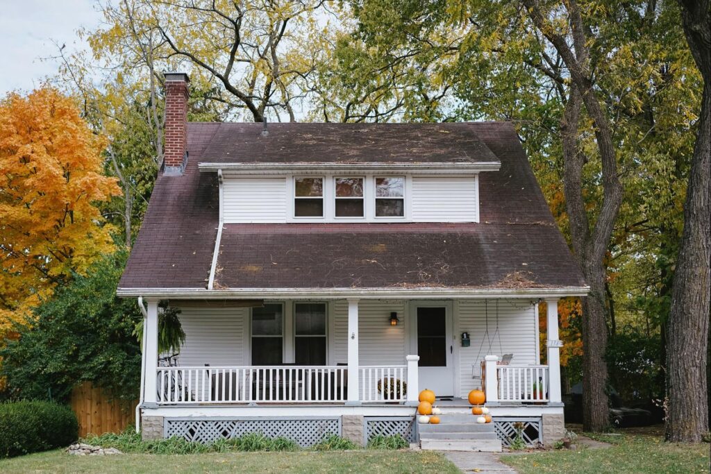 Classical wood siding and shingle roofing are typical of a bungalow-style house.