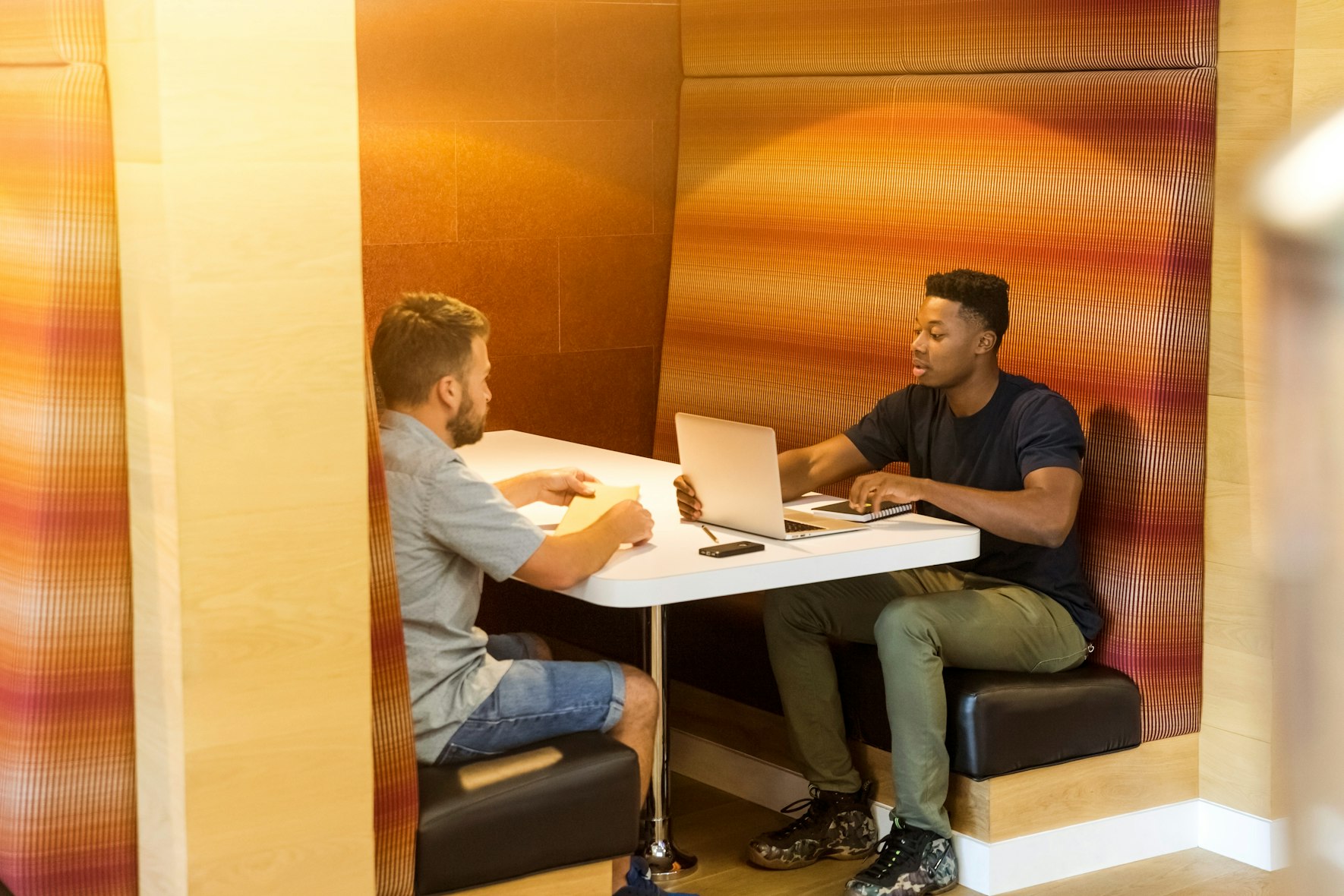 two men in a meeting
