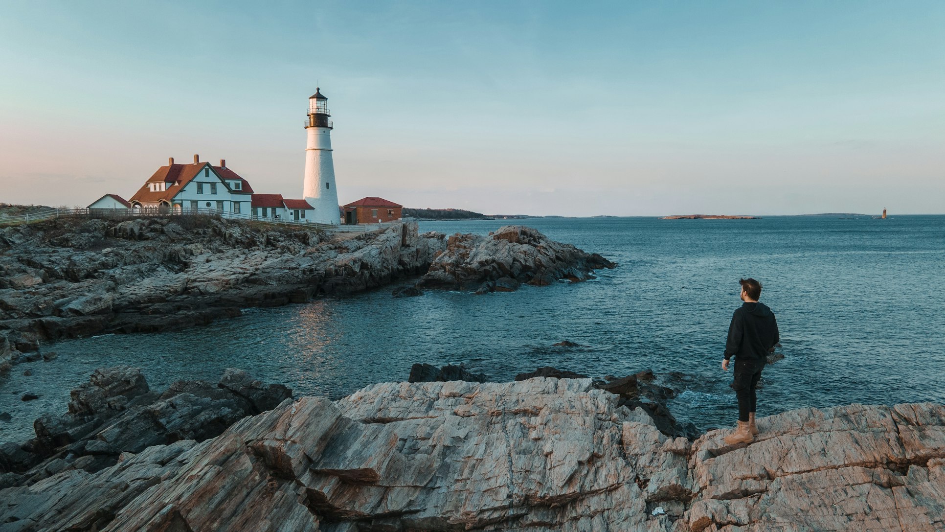 man staring at a lighthouse