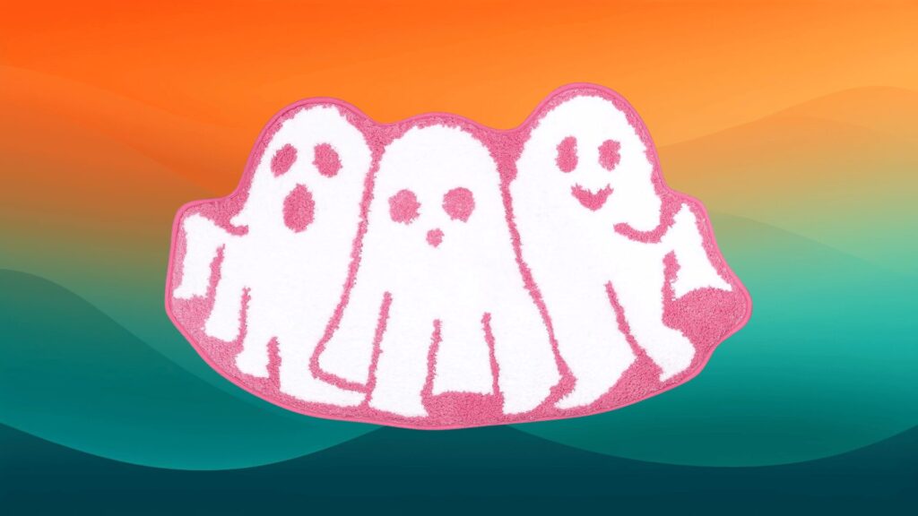 white and pink ghost bath mat in front of an orange and teal background