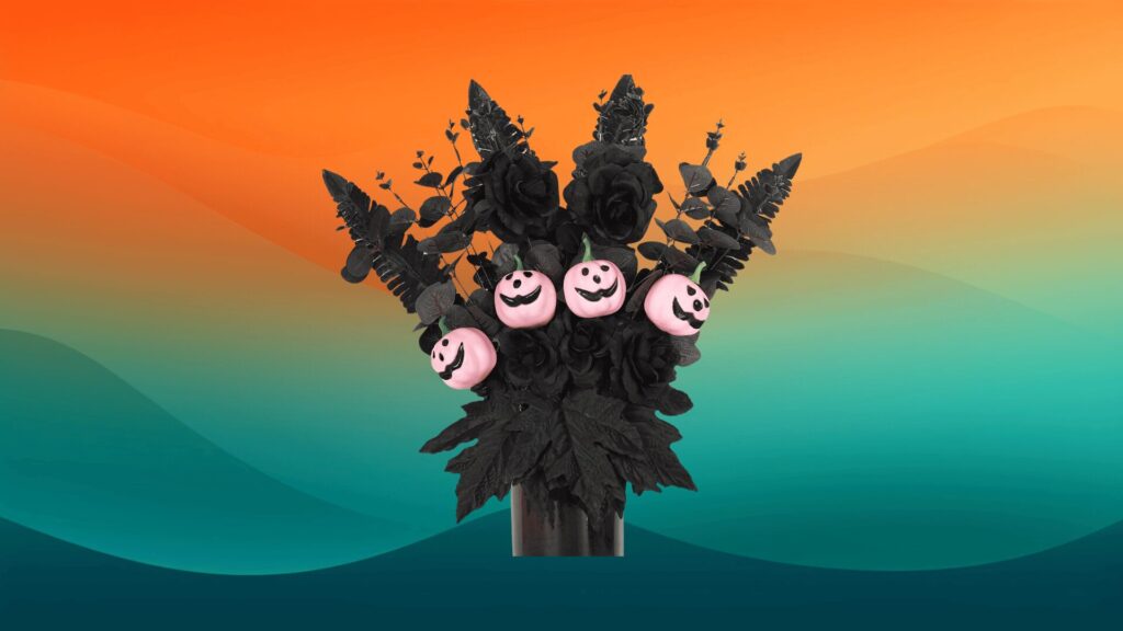 black artificial pumpkin bouquet in front of an orange and teal background