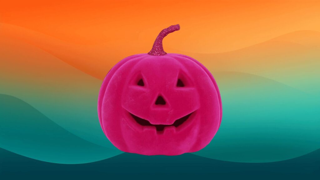 felt hot pink jack o lantern pink Halloween decor in front of an orange and teal background