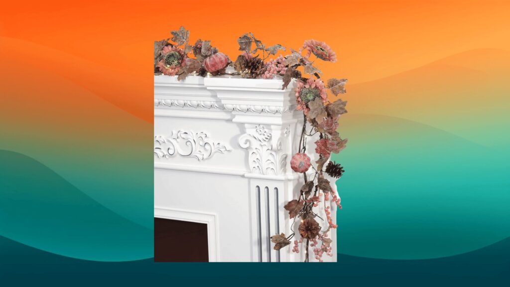 pink Halloween decor garland in front of an orange and teal background