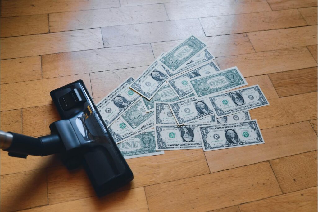 Several paper bills being vacuumed