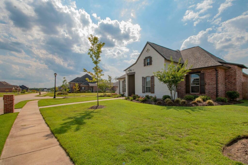 White and brown house in a subdivision