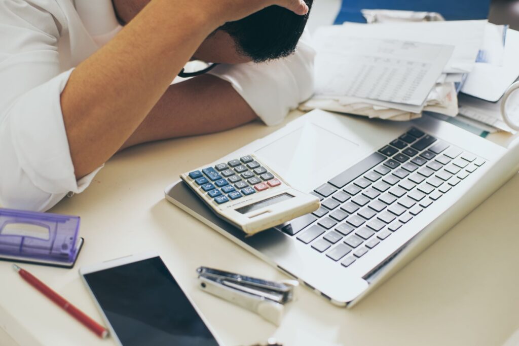 a man calculating his salary for his cost of living