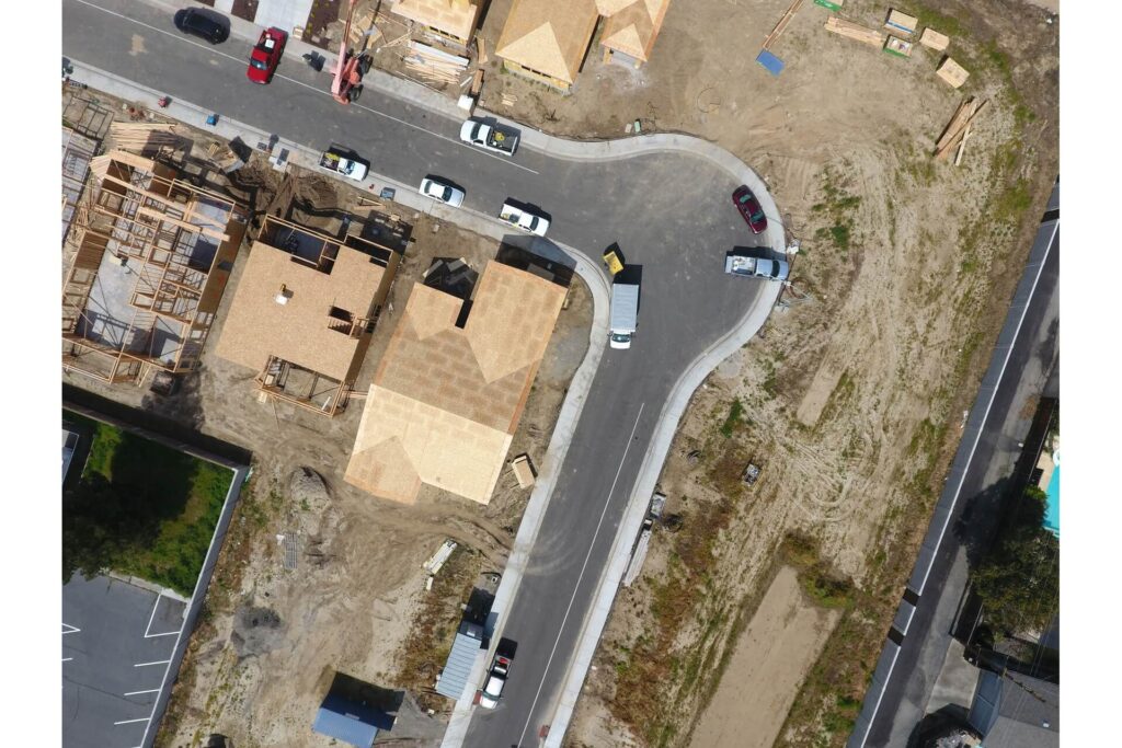 A drone shot of homes under construction.