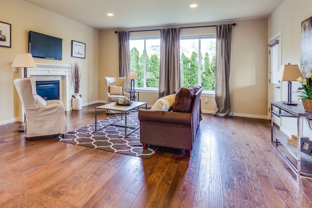 a living room with wooden sloping floors