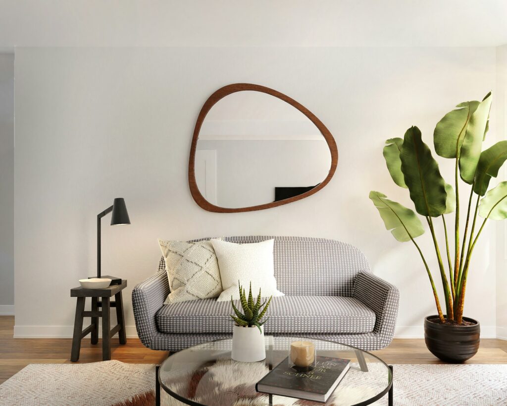 mirror hanging above a couch in an apartment