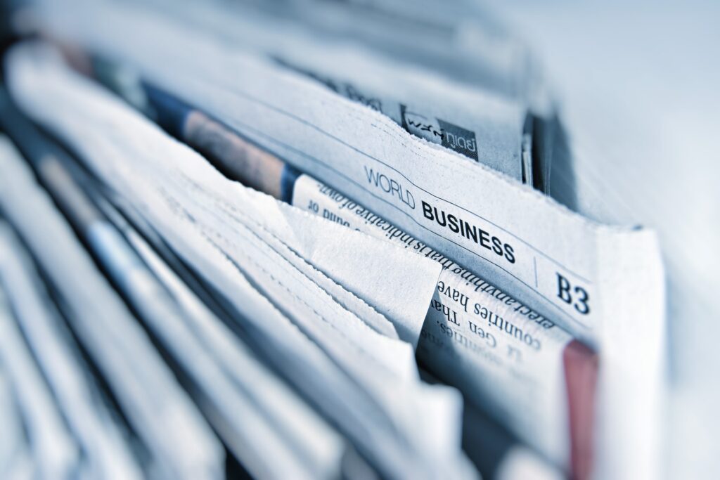 an upclose image of filed newspapers