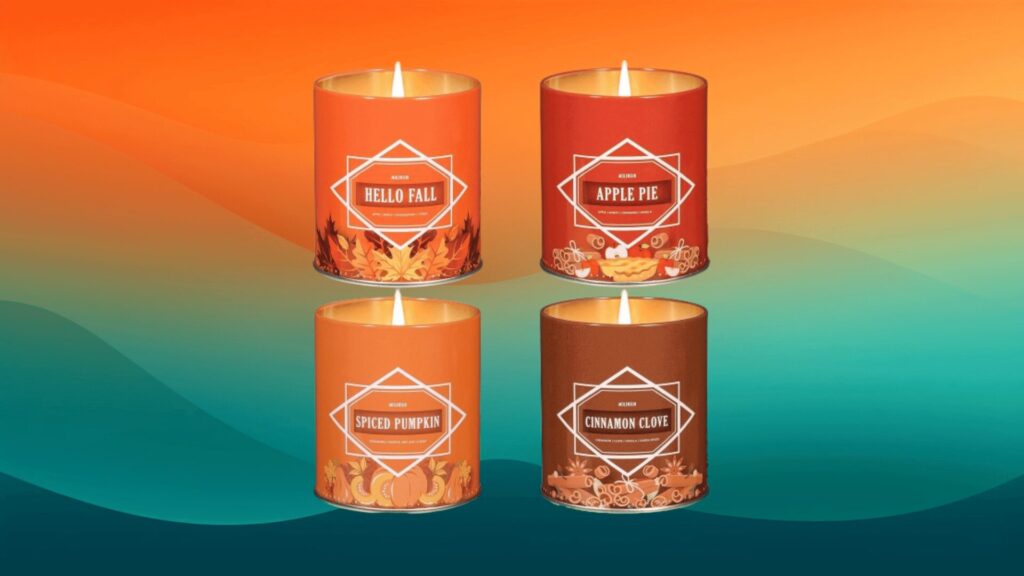 four fall scented candles in front of an orange and teal background