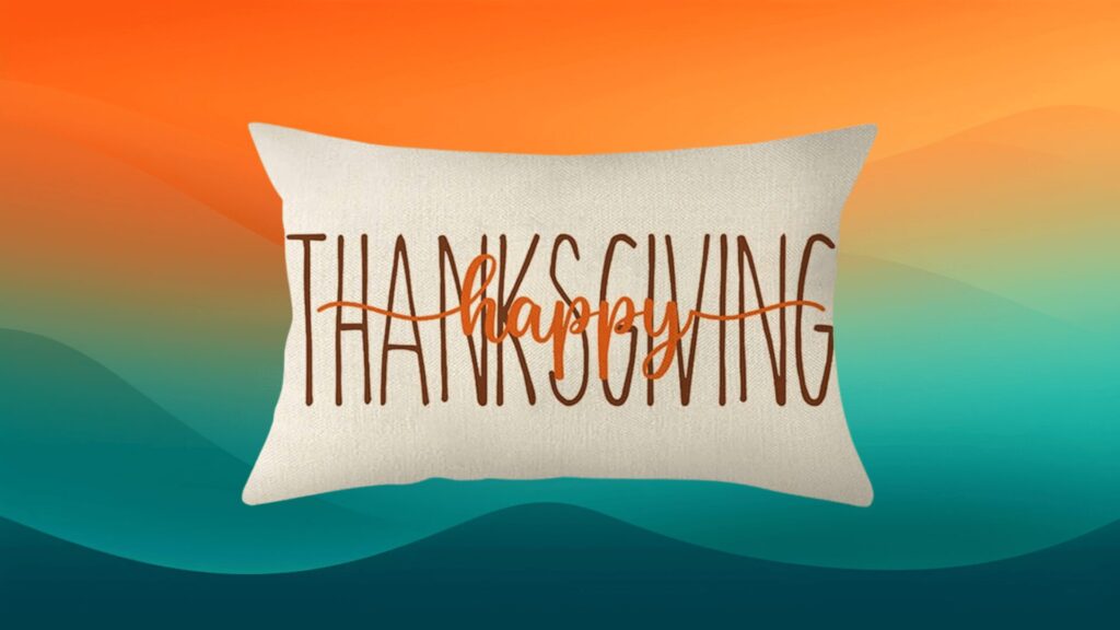 Thanksgiving decor throw pillow that says "happy Thanksgiving" in front of an orange and teal background