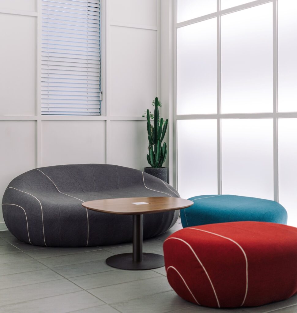 three large colored ottomans to relax on