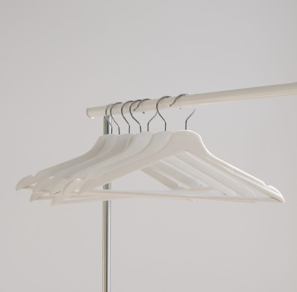white hangers flipped as a decluttering tip