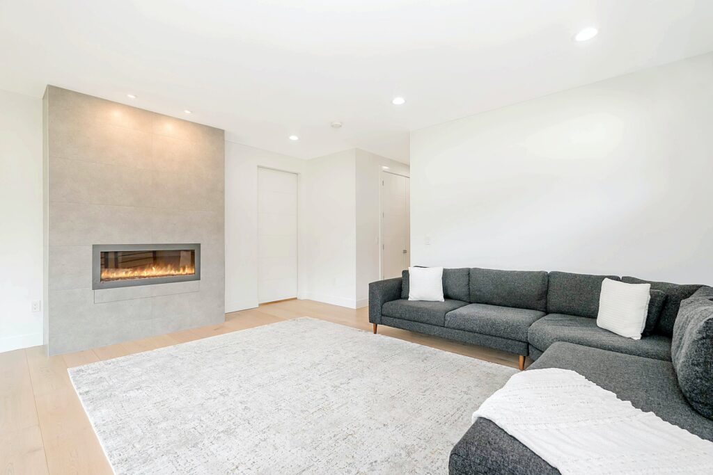 a large open-space living room with a fireplace