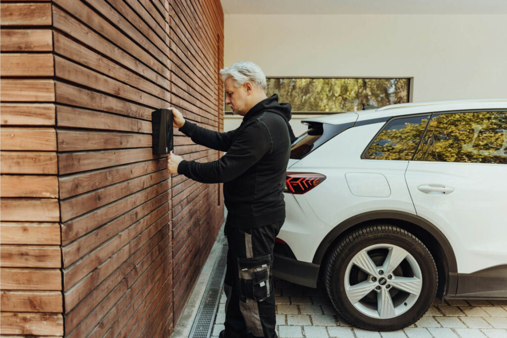 A man operating a system on a garage door