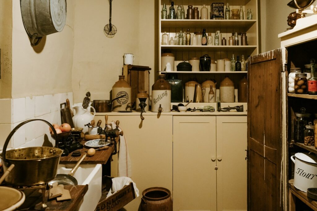 A well-equipped kitchen displaying a sink, stove, and cabinet, designed for culinary activities.
