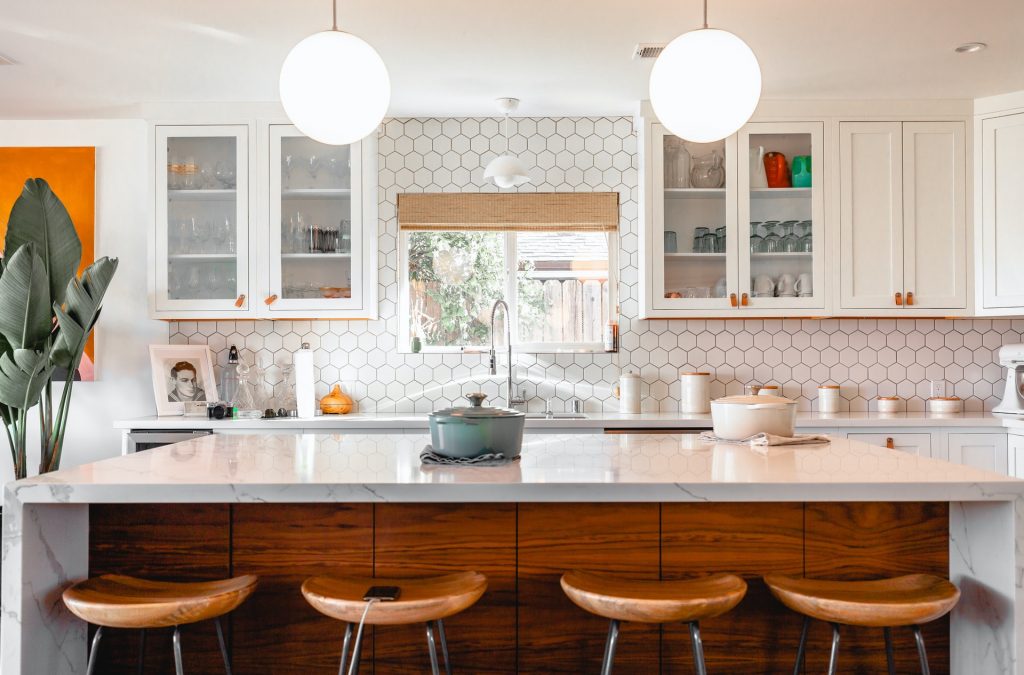 White hexagon backsplash tiles in a kitchen