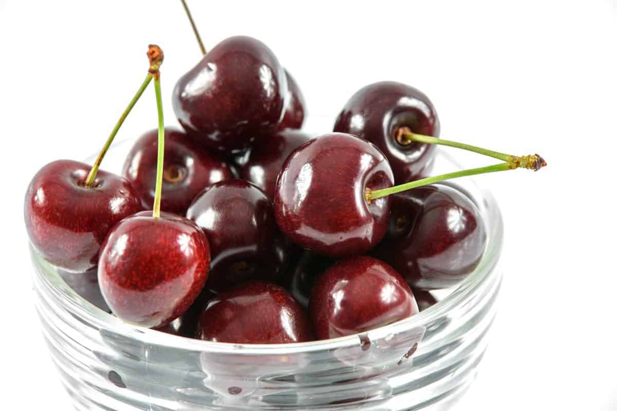 a clear bowl of cherries