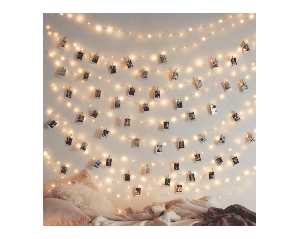 fairy lights with polaroids clipped to it