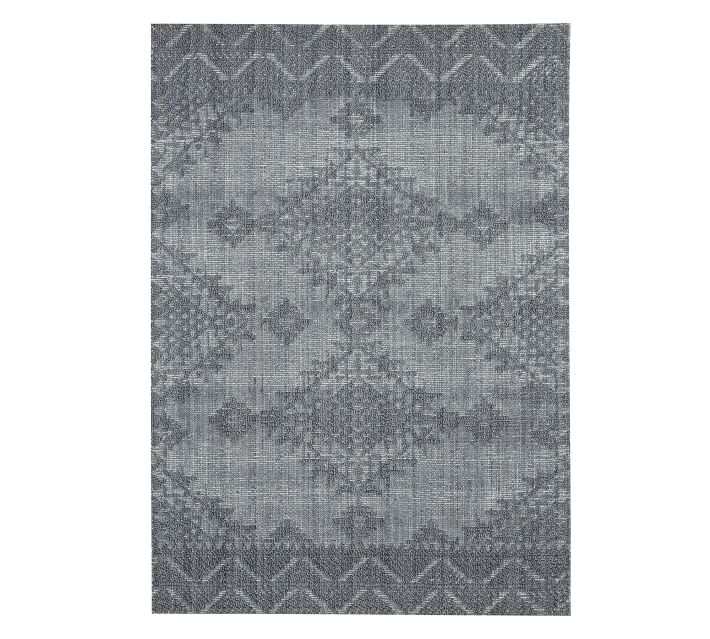 a grey geometric pattered rug