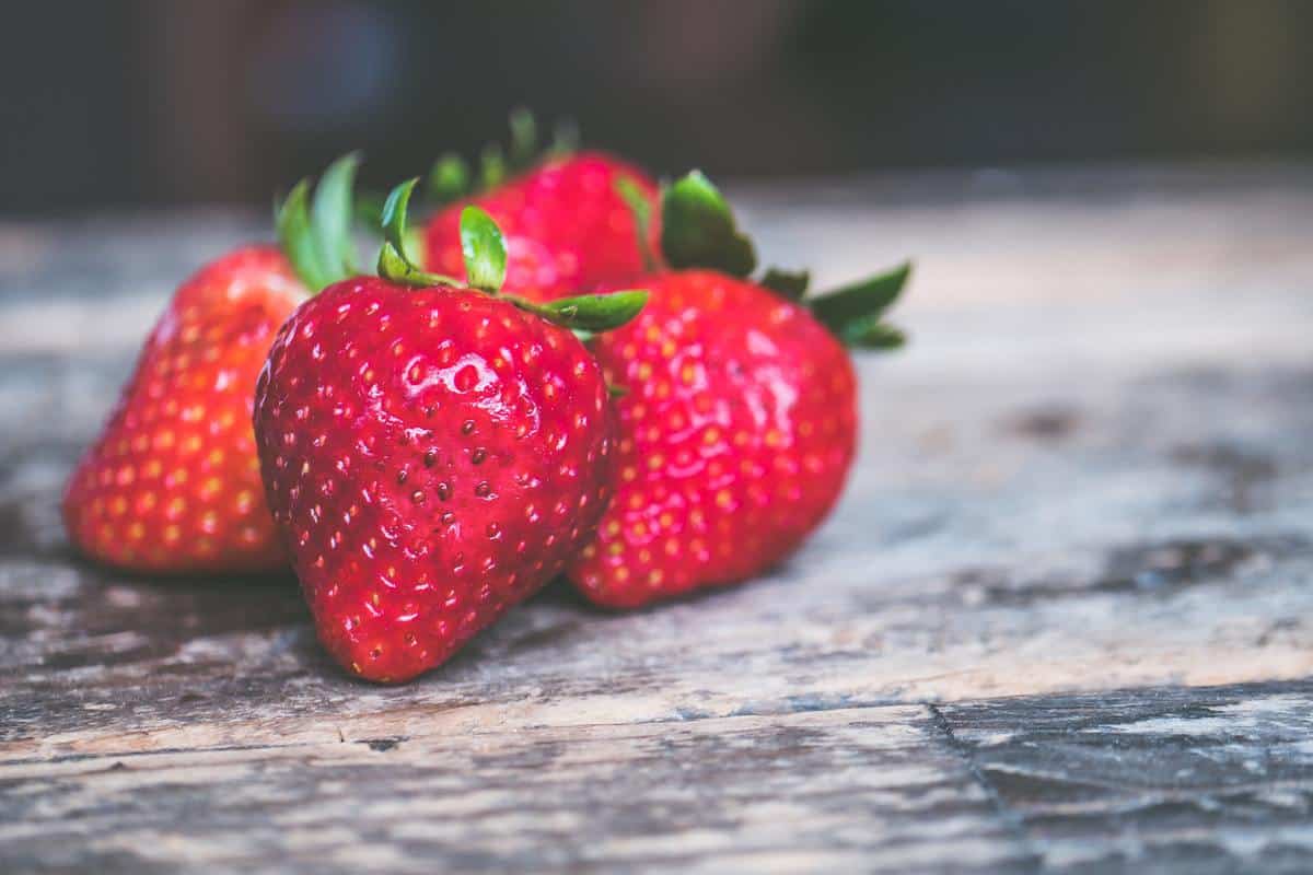 strawberries on a table as the easiest fruits to grow in your garden