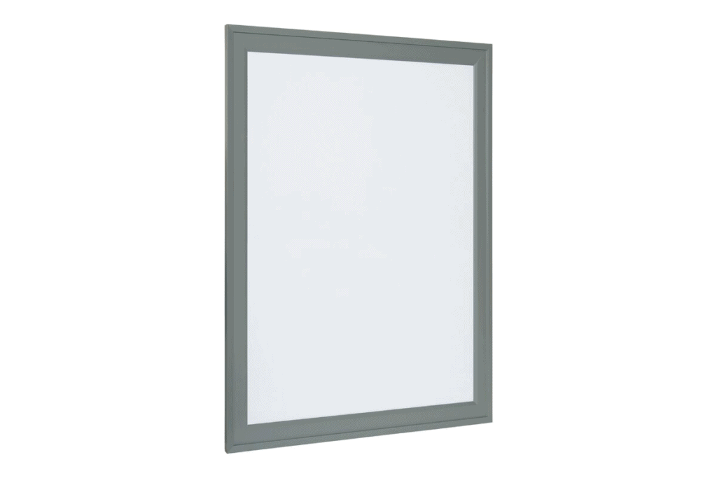 a grey framed white dry erase board
