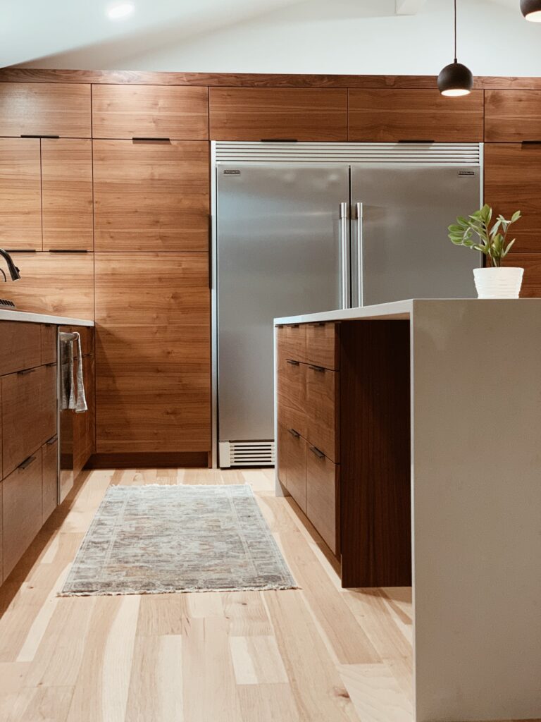 large silver fridge in a wooden kitchen for the home cook