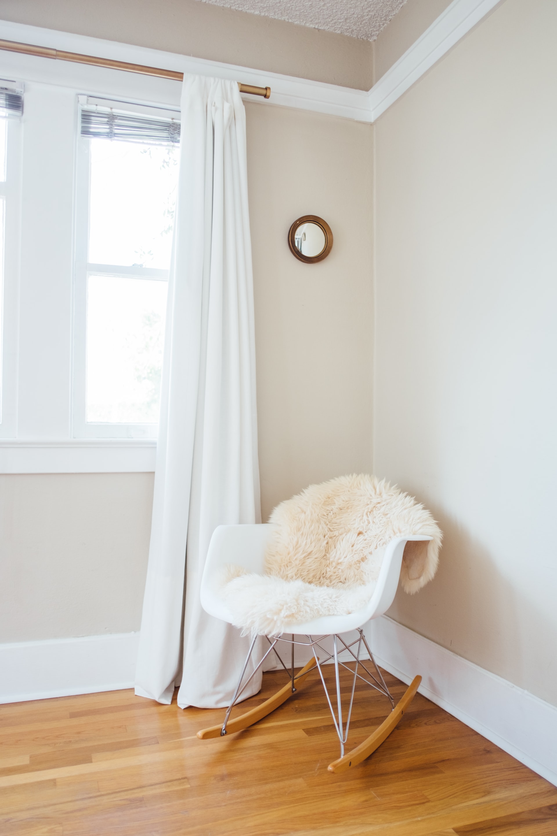 A large open window in a beige minimalist room