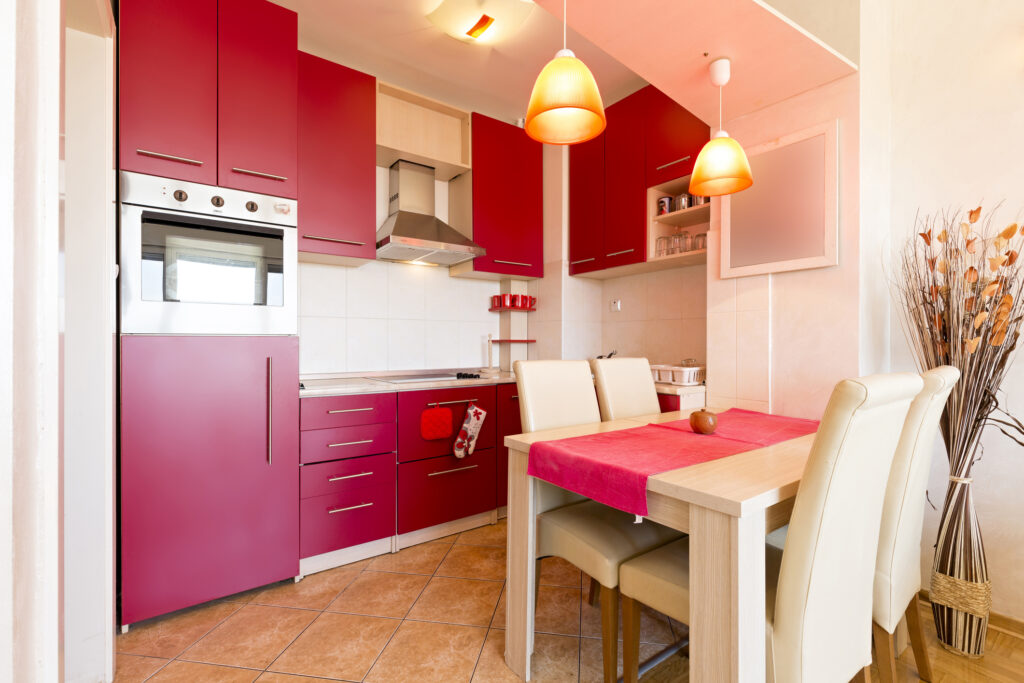 bright red kitchen cabinets in a small kitchen