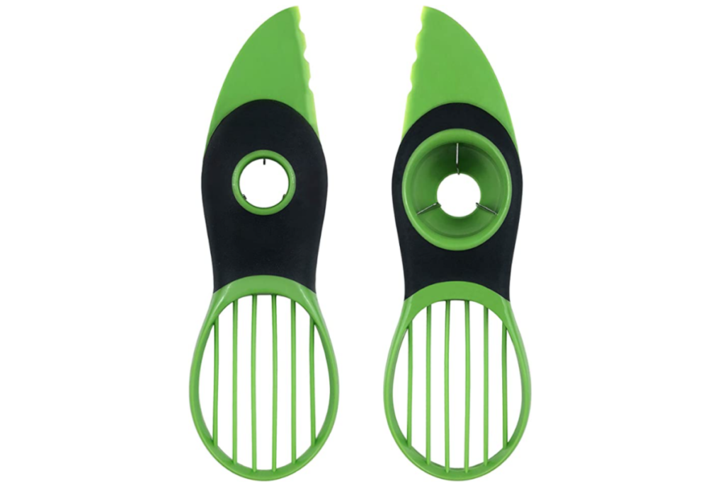 a green and black avacado slicer and de-pitter