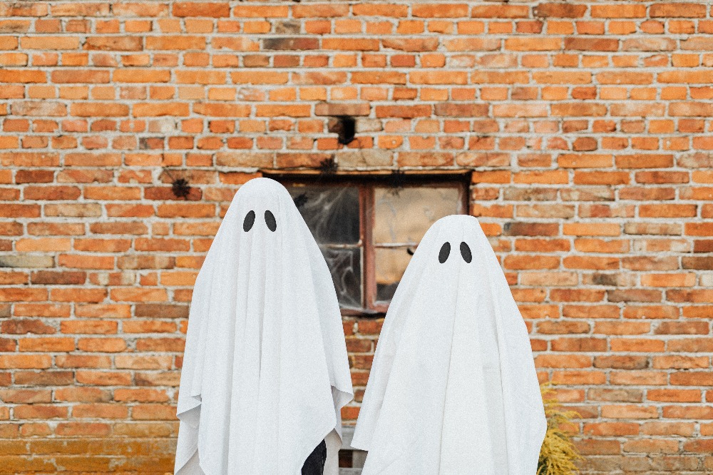 two people in sheet ghost costumes