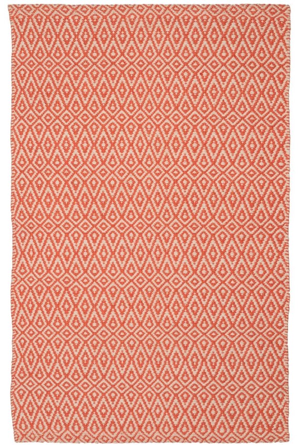 a white and peach pattered rug
