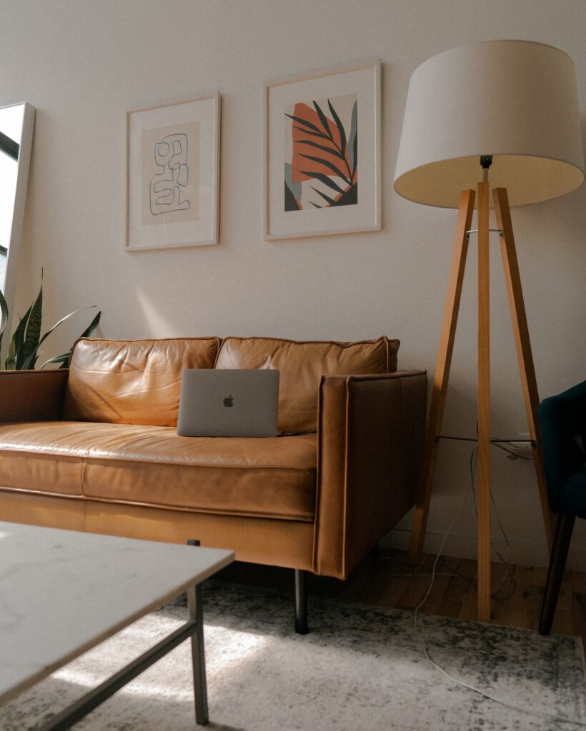 small brown leather couch in a living room