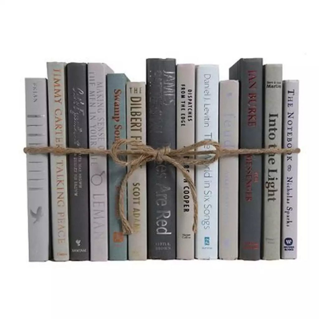 a variety of books tied together with twine