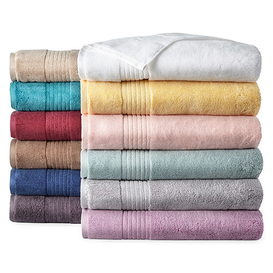 a variety of multicolored bath towels for a she shed