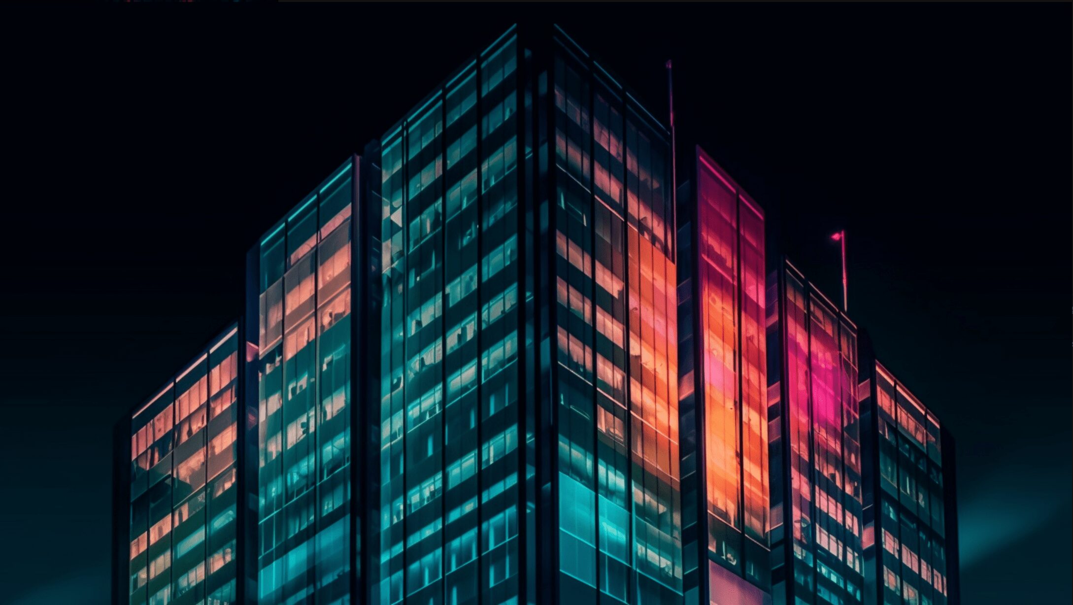 a brightly lit skyscraper with glass windows. bright colors shining through the window to make the building look multi-colored.