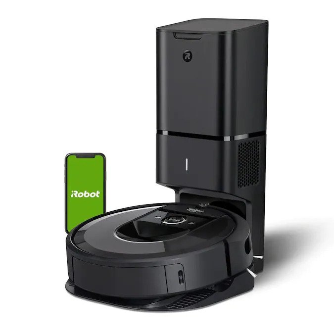 a black roomba with a phone and a port